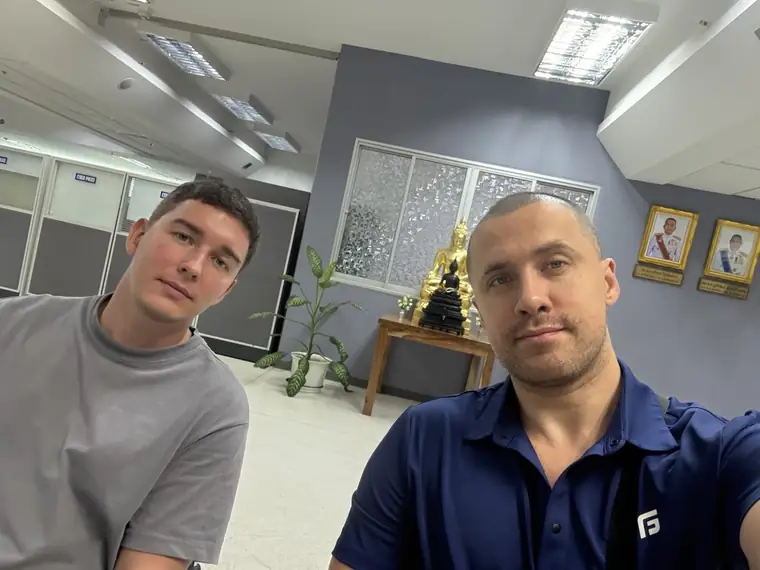 Mike with a client at the cyber police in Bangkok